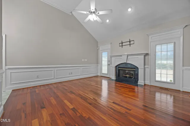 a kitchen with stainless steel appliances a cabinets and window