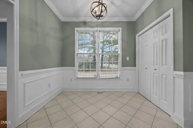 a view of an empty room and entryway