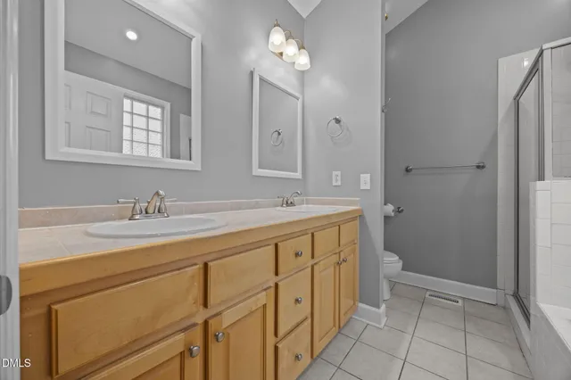 a view of a house with wooden fence