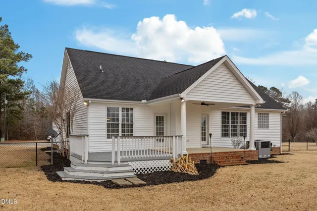 a view of a swimming pool with a yard