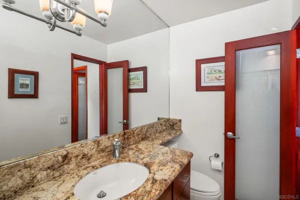 a bathroom with a glass shower door