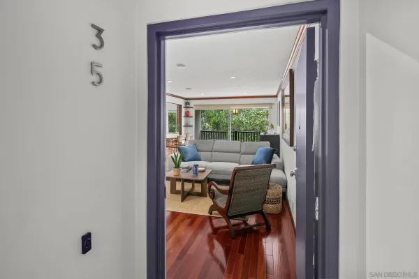 a view of a room that has a bed and a window