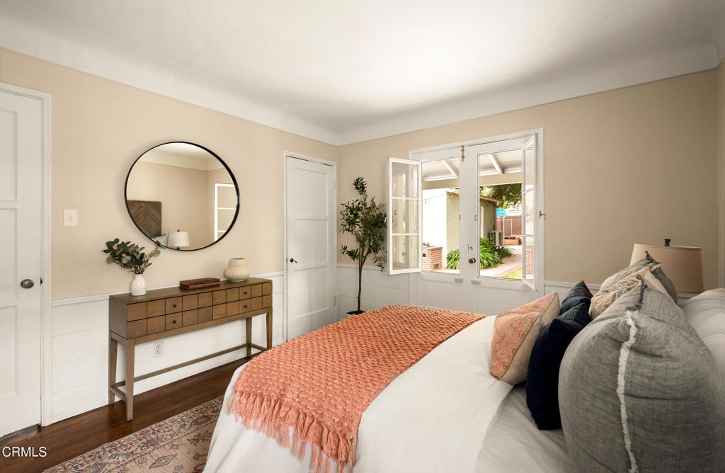 1873 North Harding Avenue Altadena, CA 91001 - Photo 23 of 55 a bedroom with a bed a mirror and a large window