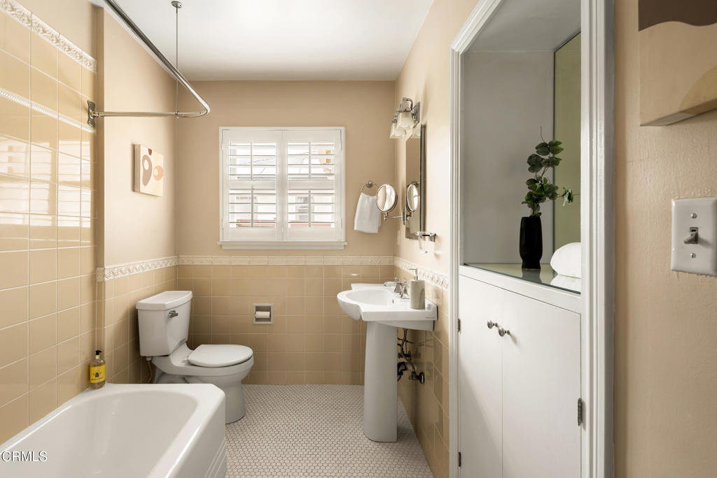 1873 North Harding Avenue Altadena, CA 91001 - Photo 26 of 55 a bathroom with a toilet sink and mirror