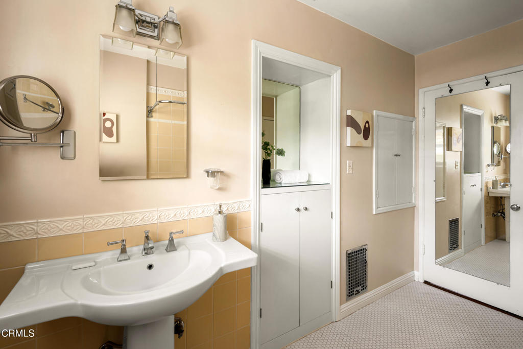 1873 North Harding Avenue Altadena, CA 91001 - Photo 27 of 55 a bathroom with a sink a toilet and a mirror