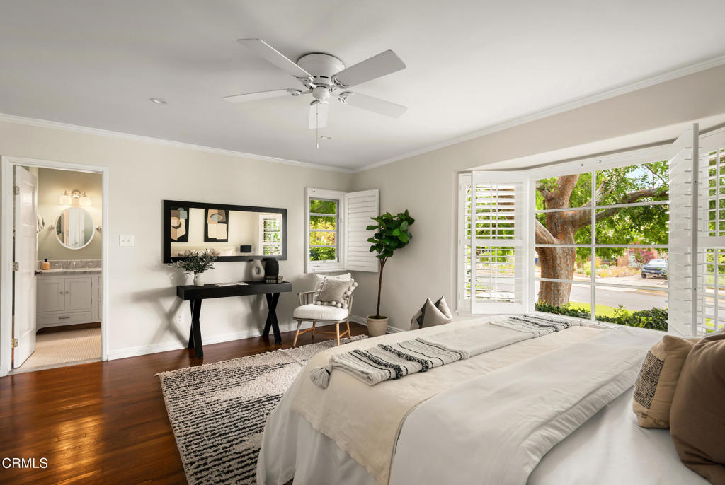 1873 North Harding Avenue Altadena, CA 91001 - Photo 31 of 55 a bedroom with a bed a chandelier and next to a window