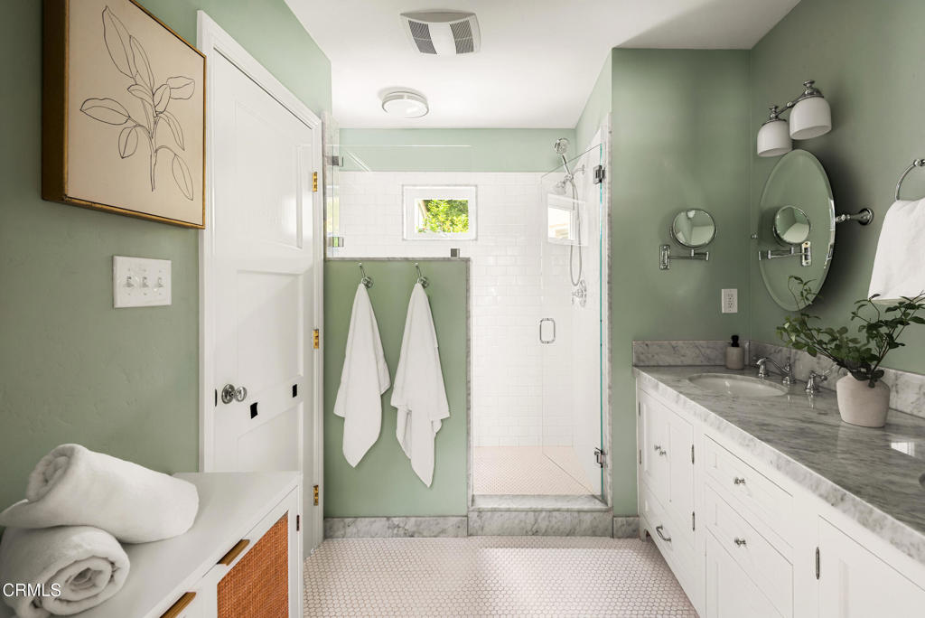 1873 North Harding Avenue Altadena, CA 91001 - Photo 33 of 55 a spacious bathroom with a granite countertop sink and a mirror