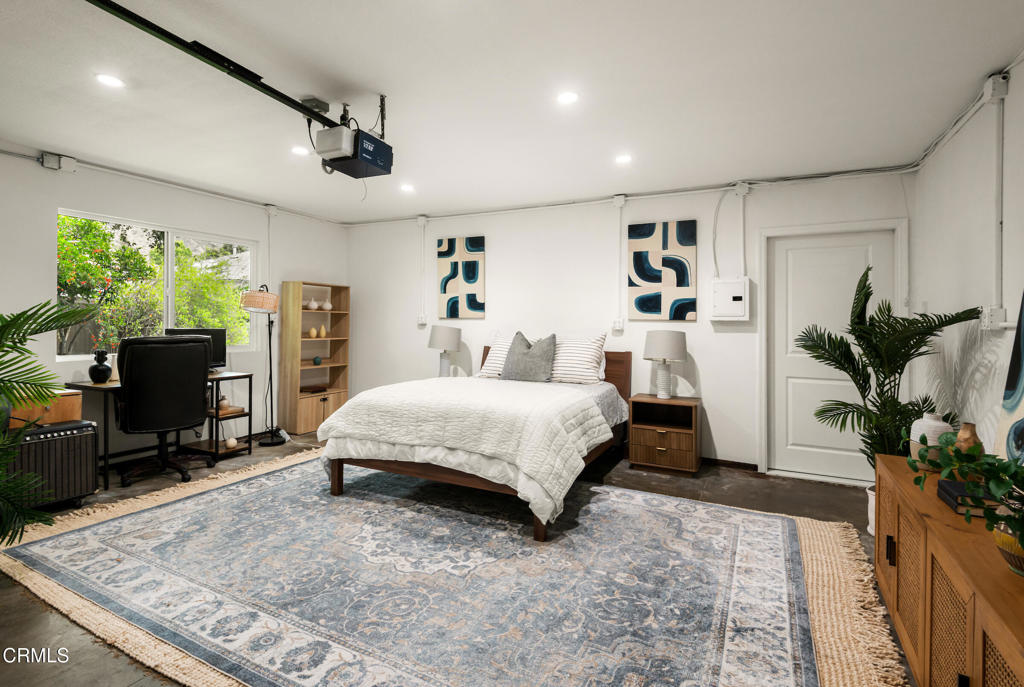 1873 North Harding Avenue Altadena, CA 91001 - Photo 35 of 55 a spacious bedroom with a large bed and a flat screen tv