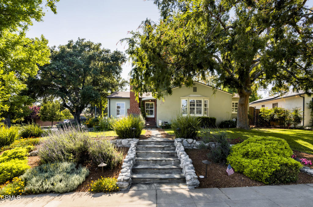 1873 North Harding Avenue Altadena, CA 91001 - Photo 47 of 55 a front view of a house with a yard and potted plants