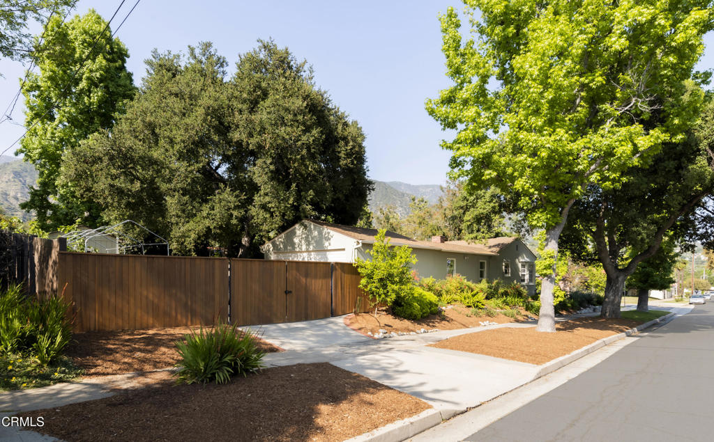 1873 North Harding Avenue Altadena, CA 91001 - Photo 48 of 55 a view of a brick house with plants and large trees