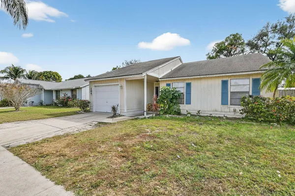 front view of a house with a yard