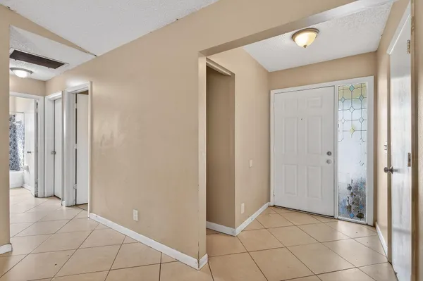 a view of a hallway to rooms