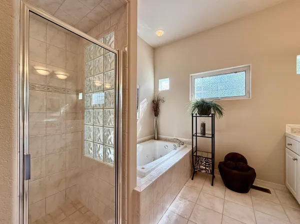 a spacious bathroom with a sink and a mirror