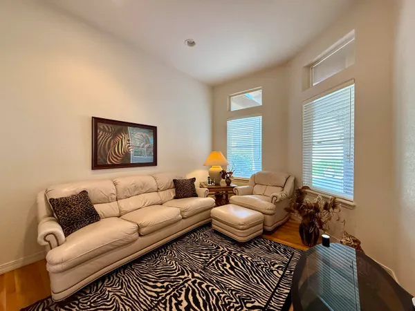 a dining room with furniture and window