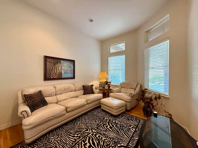 a dining room with furniture and window