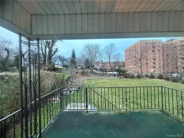 a view of a field of grass and trees