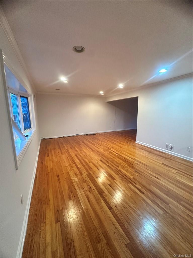 545 Pelham Road New Rochelle, NY 10805 - Photo 5 of 25 a view of empty room with wooden floor
