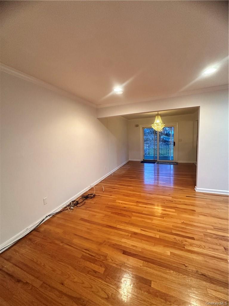 545 Pelham Road New Rochelle, NY 10805 - Photo 6 of 25 a view of empty room with wooden floor