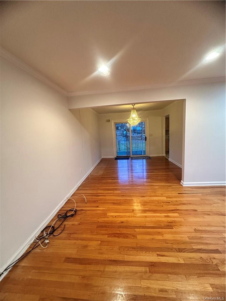 545 Pelham Road New Rochelle, NY 10805 - Photo 7 of 25 a view of a room with wooden floor