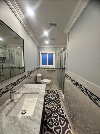 a bathroom with a sink and mirror