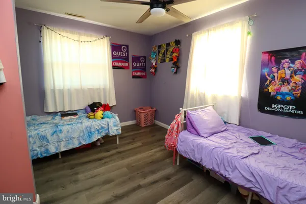 a bedroom with bed and a window