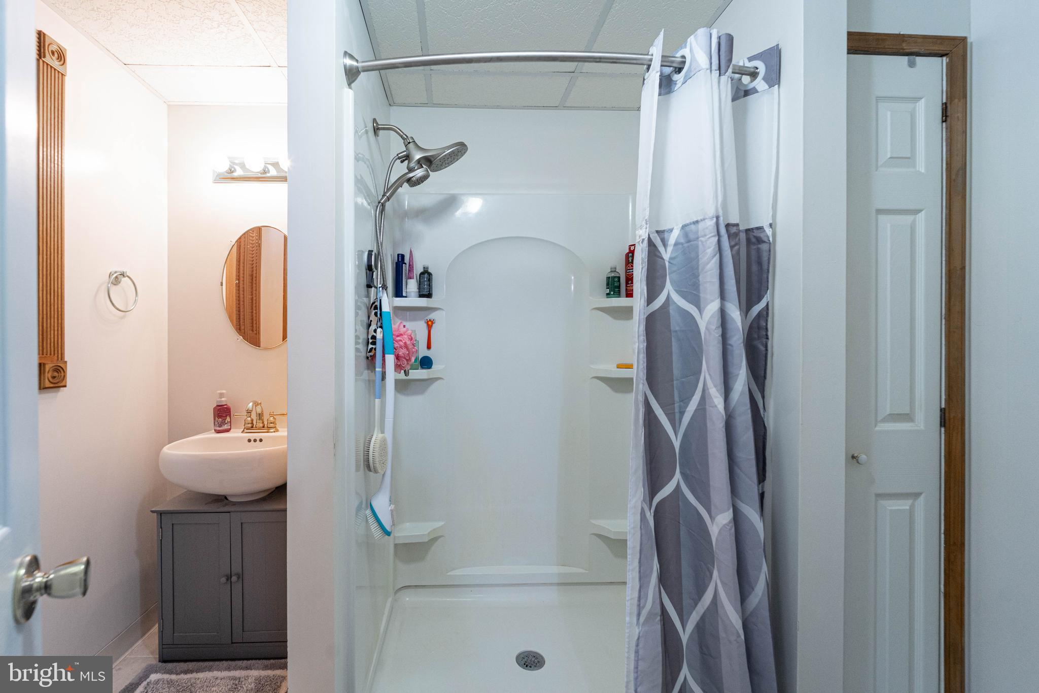 120 Tennessee Road Stevensville, MD 21666 - Photo 28 of 49 a bathroom with a shower curtain and a shower