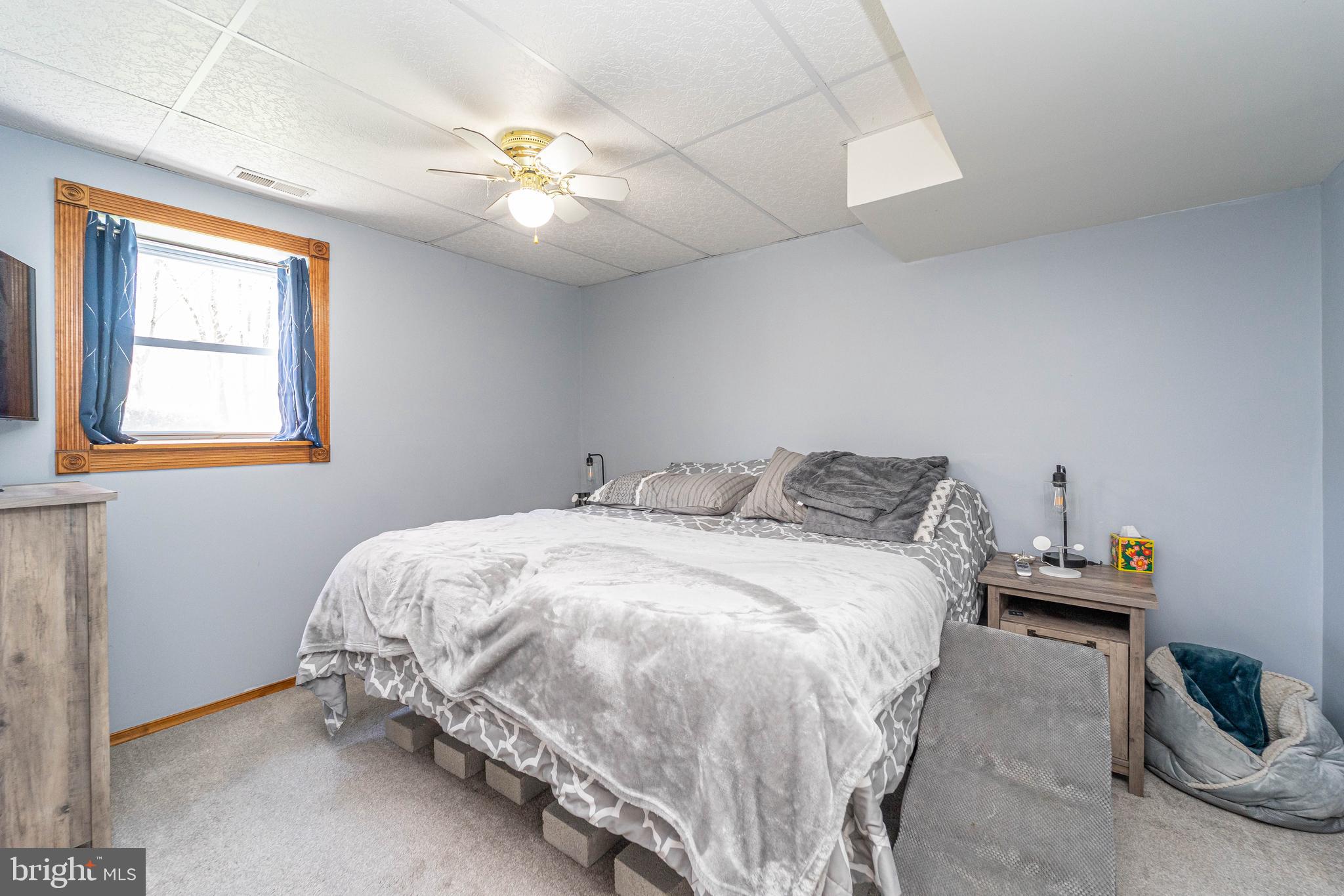 120 Tennessee Road Stevensville, MD 21666 - Photo 29 of 49 a bed sitting in a bedroom next to a window