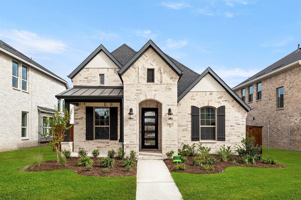 2417 Latimer Mews Celina, TX 75009 - Photo 1 of 1 a front view of a house with garden