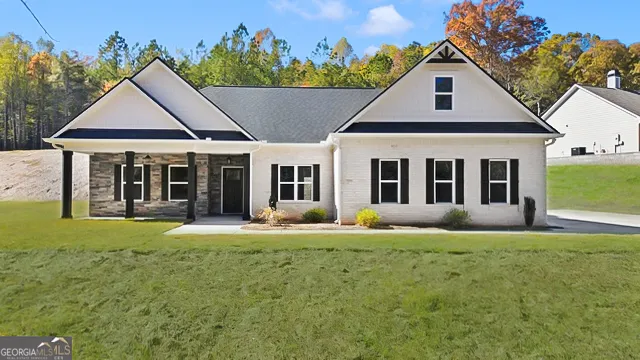 front view of a house with a yard