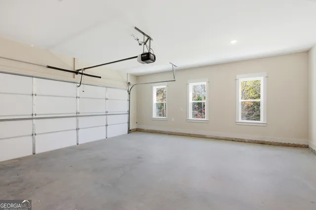 a view of a livingroom with an empty space and a window