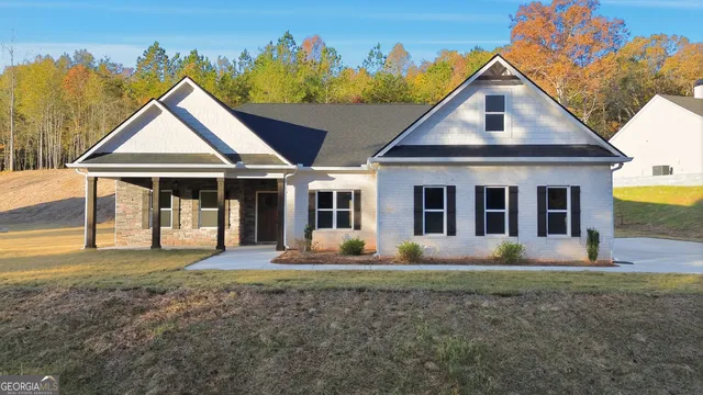 a front view of a house with a yard