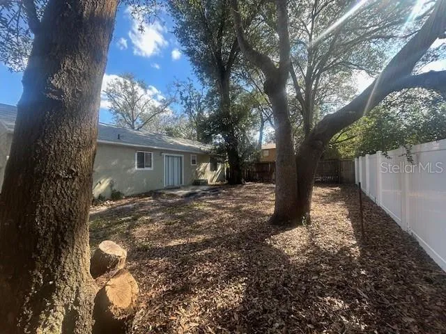a backyard of a house with lots of green space