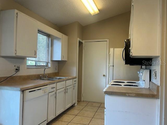 2523 Alexa Court Winter Park, FL 32792 - Photo 5 of 20 a kitchen with stainless steel appliances granite countertop a sink stove and cabinets