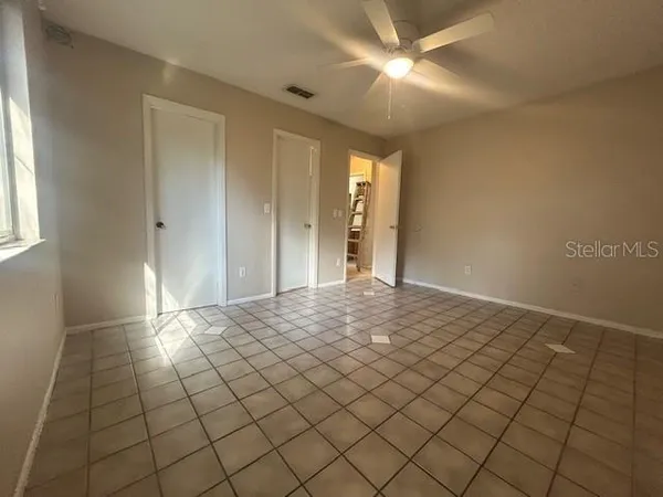 a view of an empty room and window