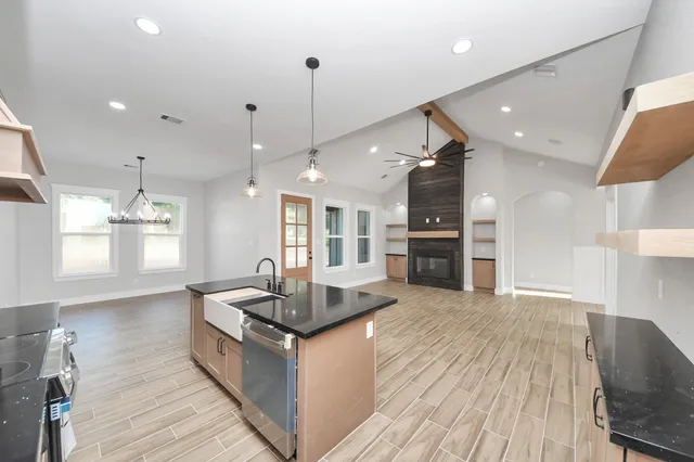 a view of wooden floor and windows in a room