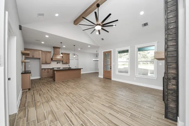 a view of kitchen with cabinets and wooden floor