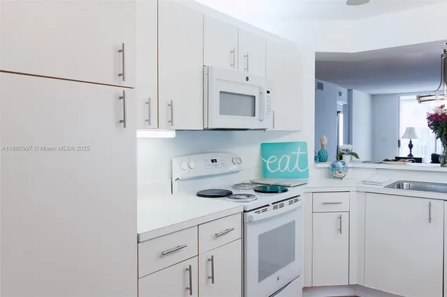 a kitchen with cabinets a sink and dishwasher