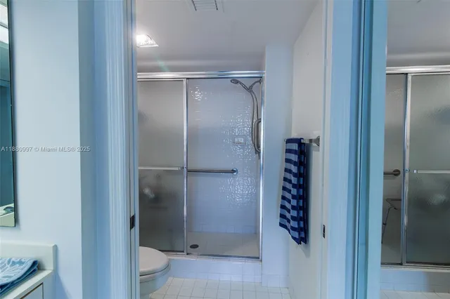a bathroom with a shower and a toilet