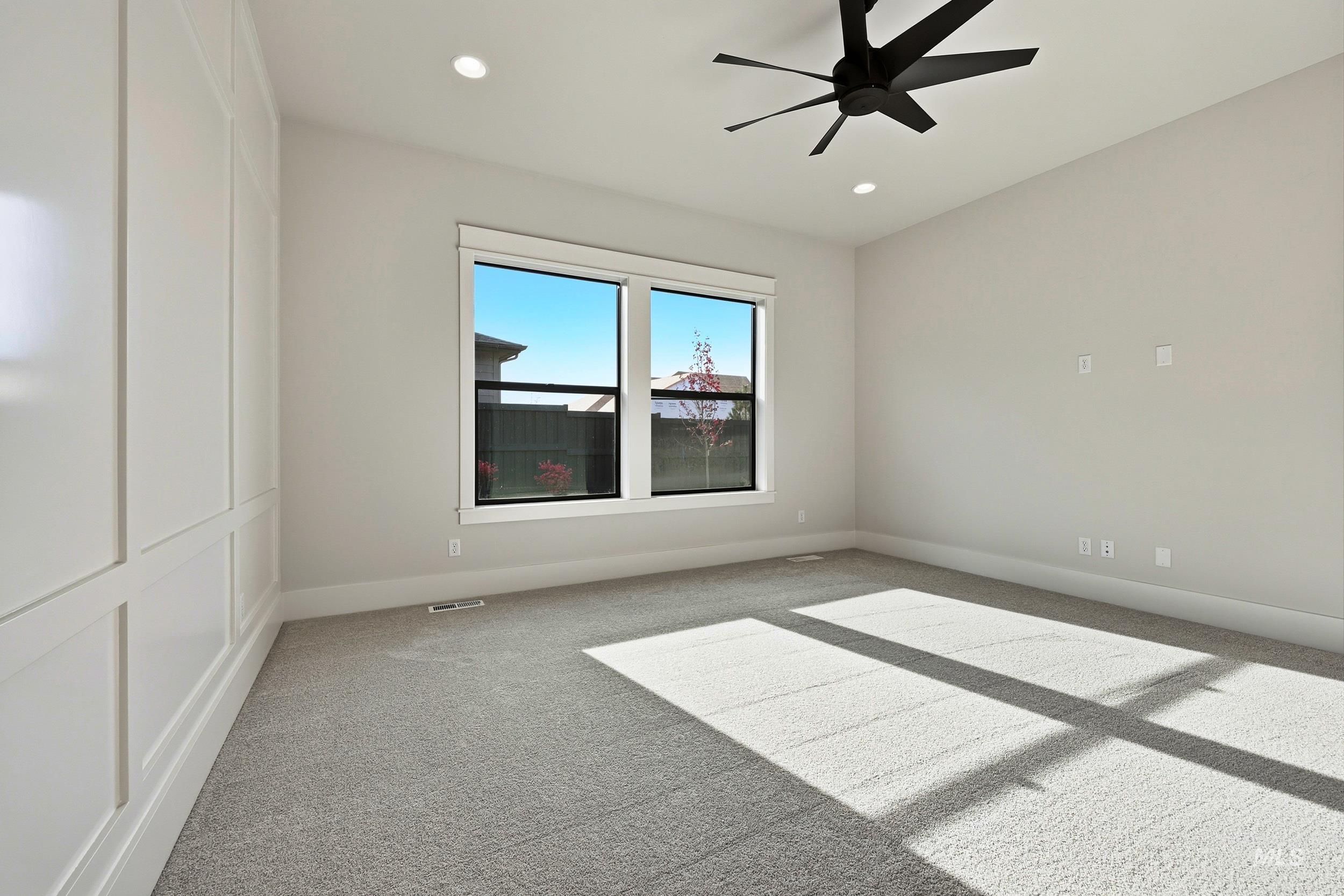 1090 East Crescendo Street Meridian, ID 83642 - Photo 12 of 43 Unfurnished room featuring light carpet, a ceiling fan, and recessed lighting