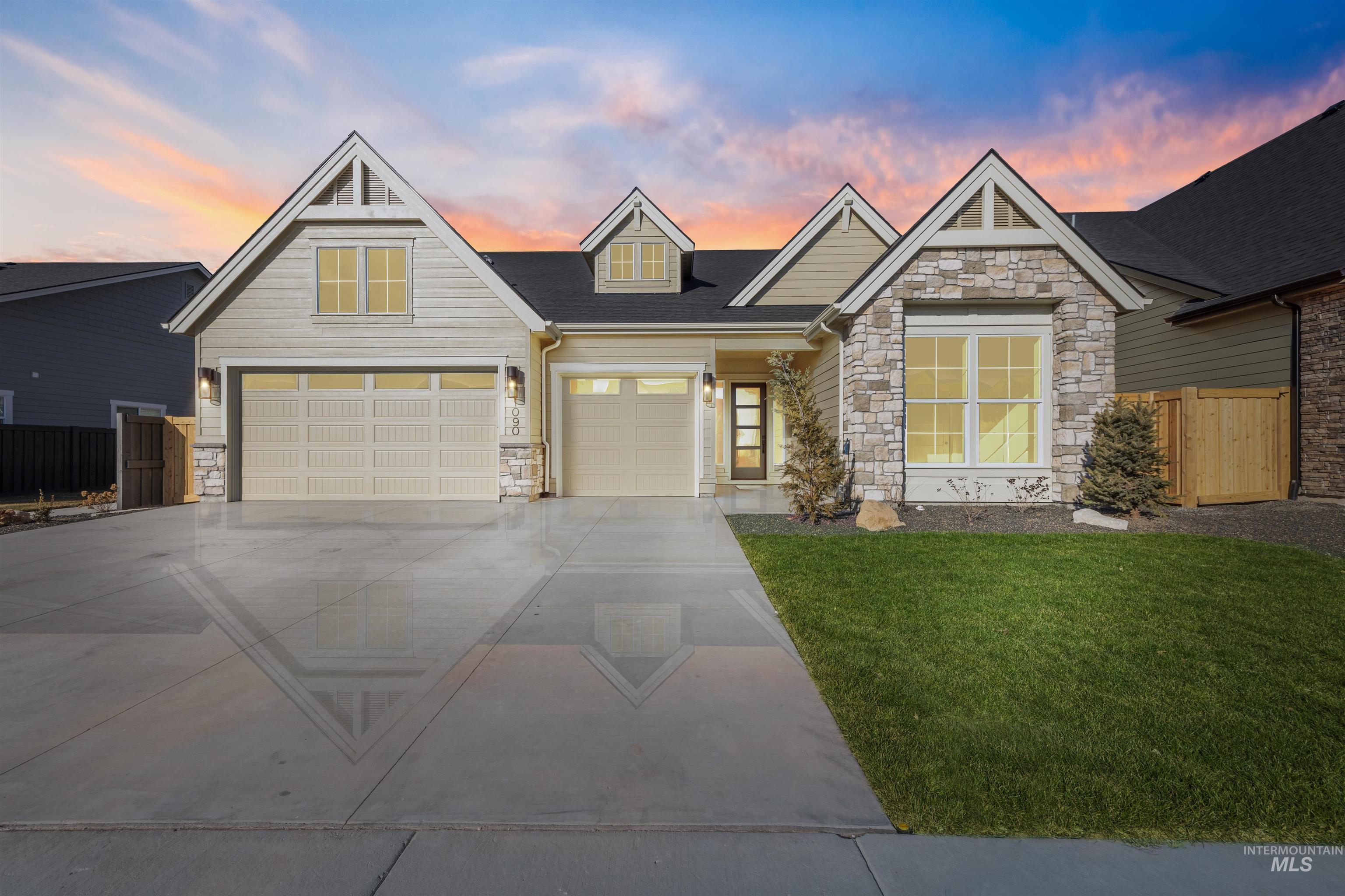1090 East Crescendo Street Meridian, ID 83642 - Photo 2 of 50 Craftsman-style house featuring stone siding and concrete driveway