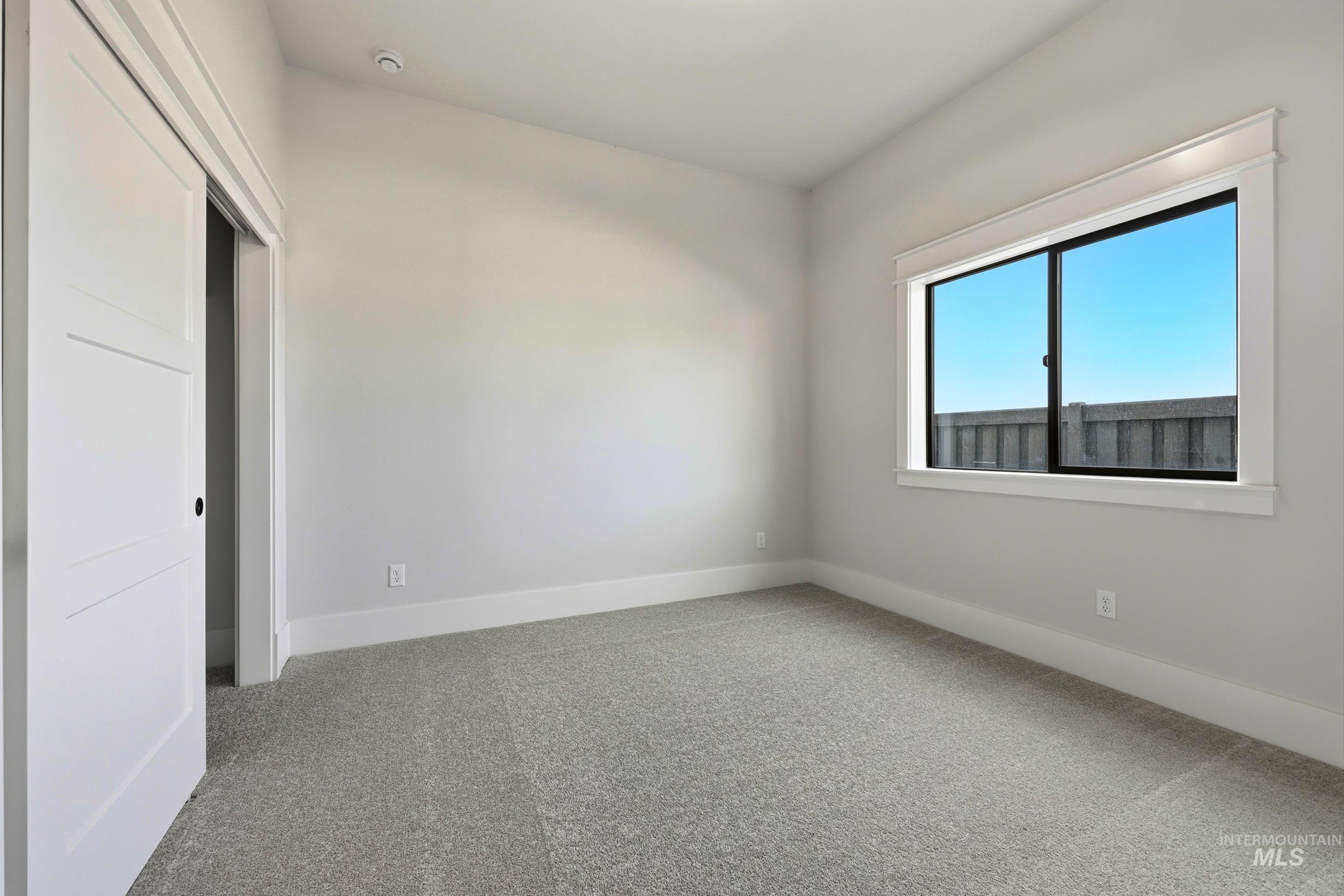 1090 East Crescendo Street Meridian, ID 83642 - Photo 20 of 43 Unfurnished bedroom featuring carpet and a closet