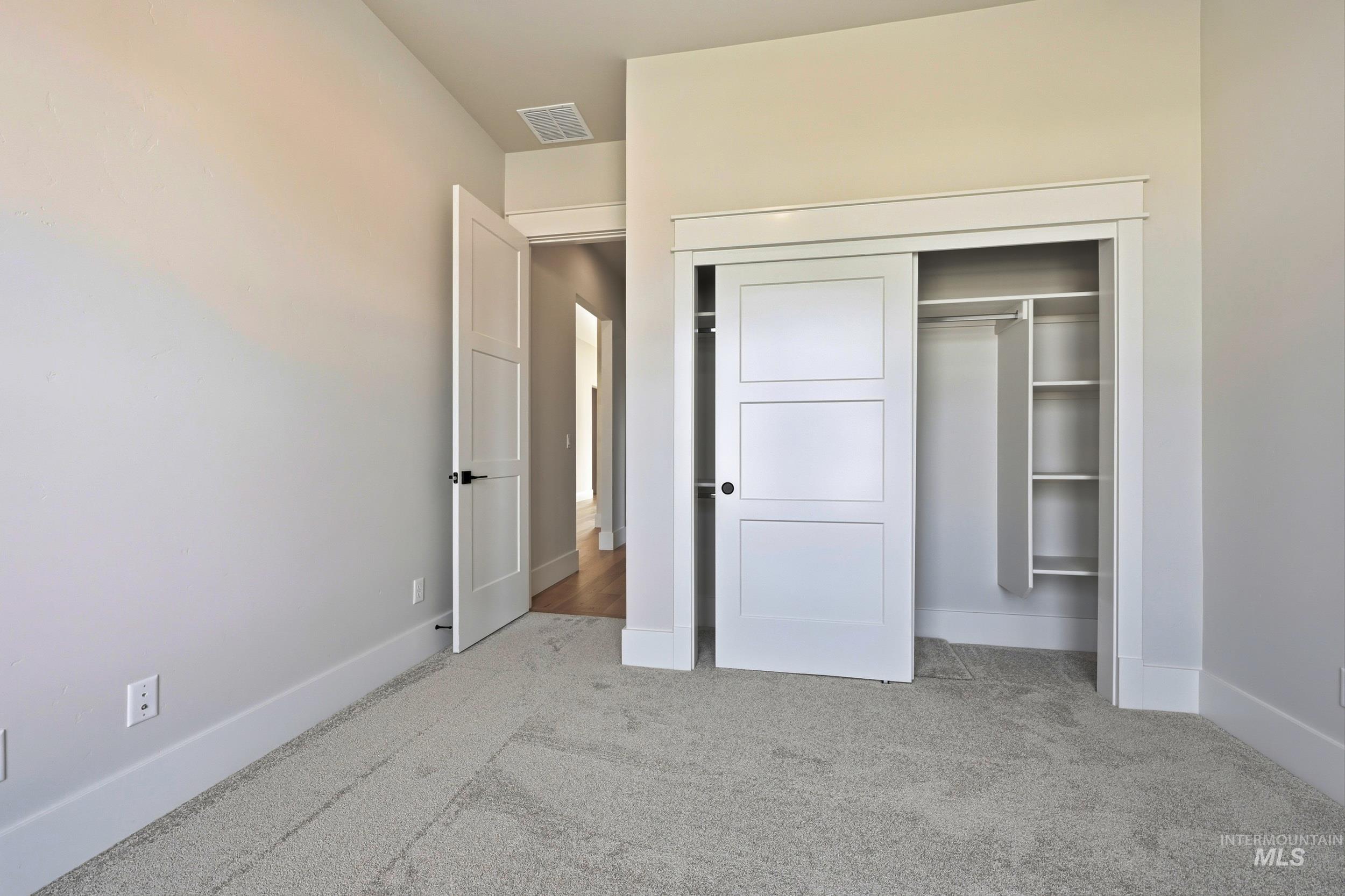 1090 East Crescendo Street Meridian, ID 83642 - Photo 23 of 43 Unfurnished bedroom with a closet and light colored carpet