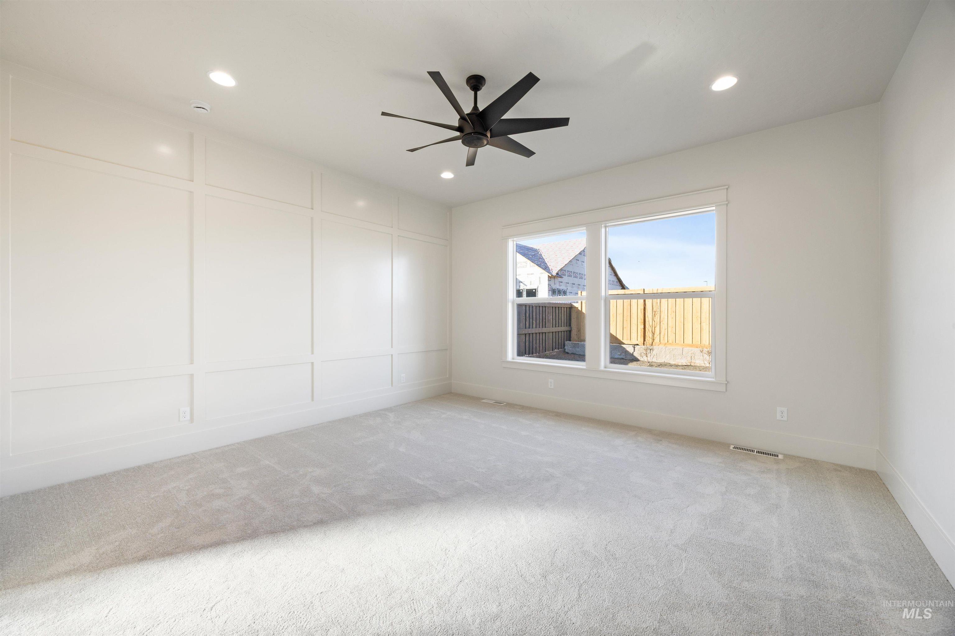 1090 East Crescendo Street Meridian, ID 83642 - Photo 26 of 50 Carpeted spare room featuring a decorative wall, ceiling fan, and recessed lighting