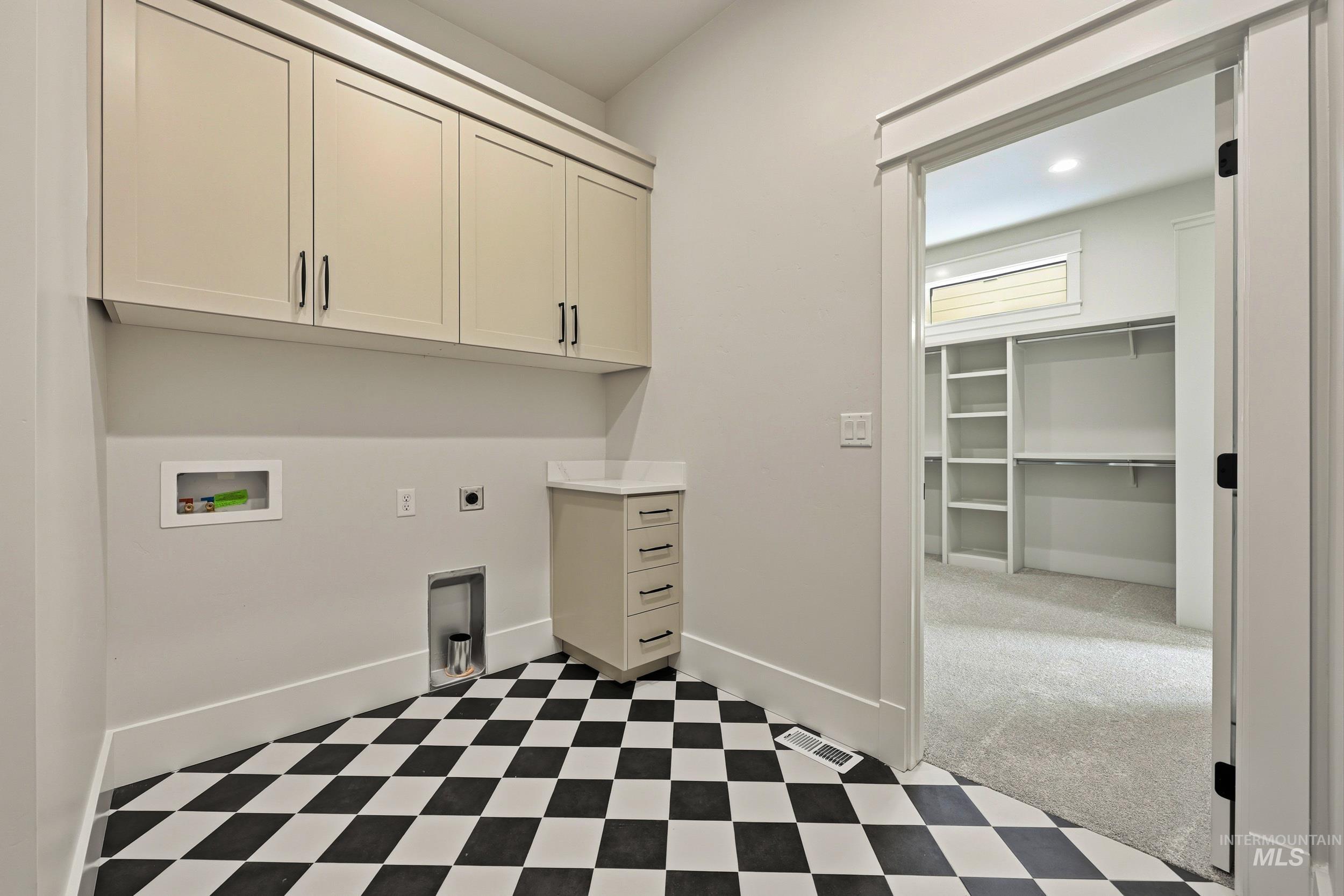 1090 East Crescendo Street Meridian, ID 83642 - Photo 32 of 43 Laundry room with hookup for an electric dryer, light floors, cabinet space, washer hookup, and recessed lighting