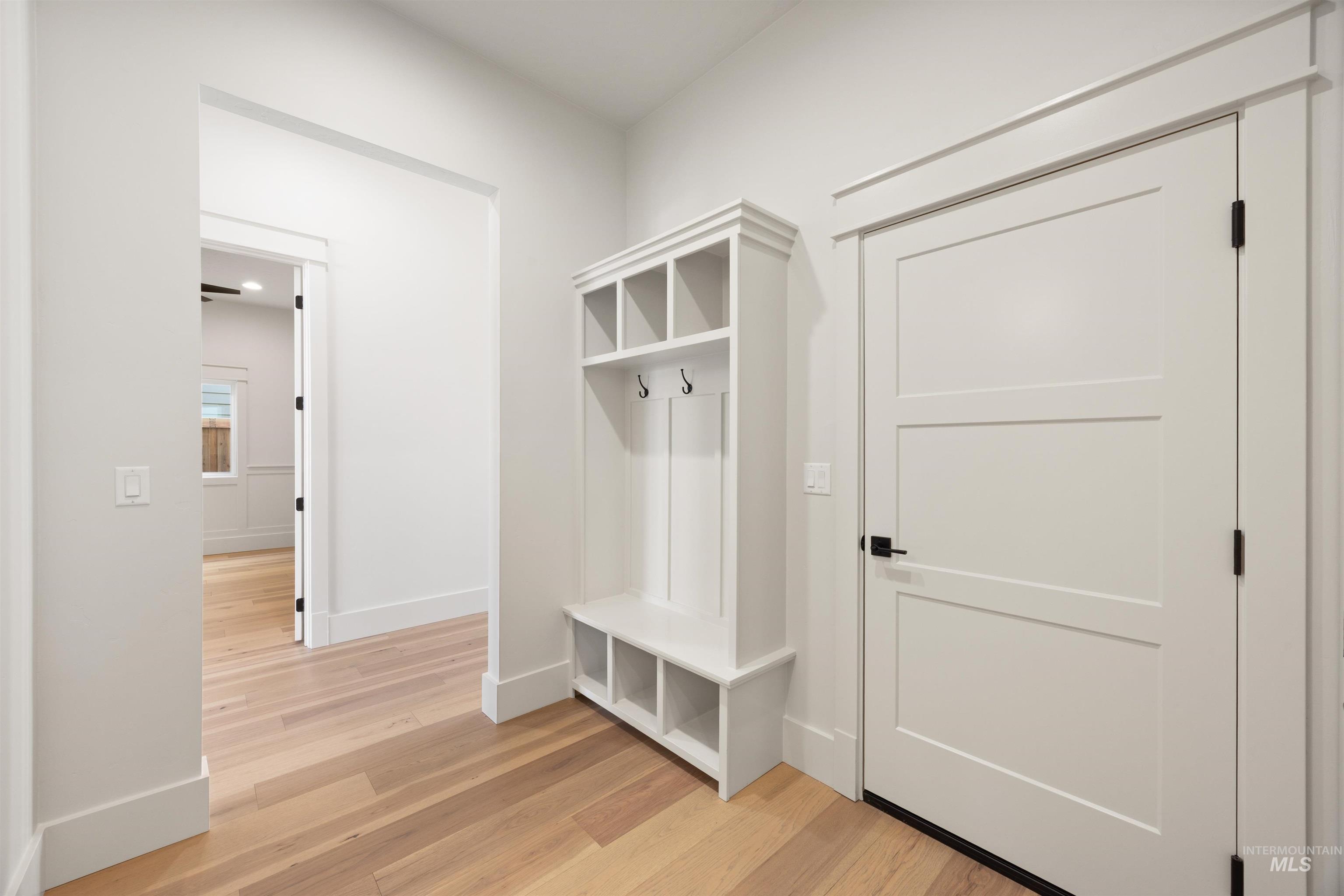 1090 East Crescendo Street Meridian, ID 83642 - Photo 35 of 50 Mudroom featuring light wood-style floors and baseboards