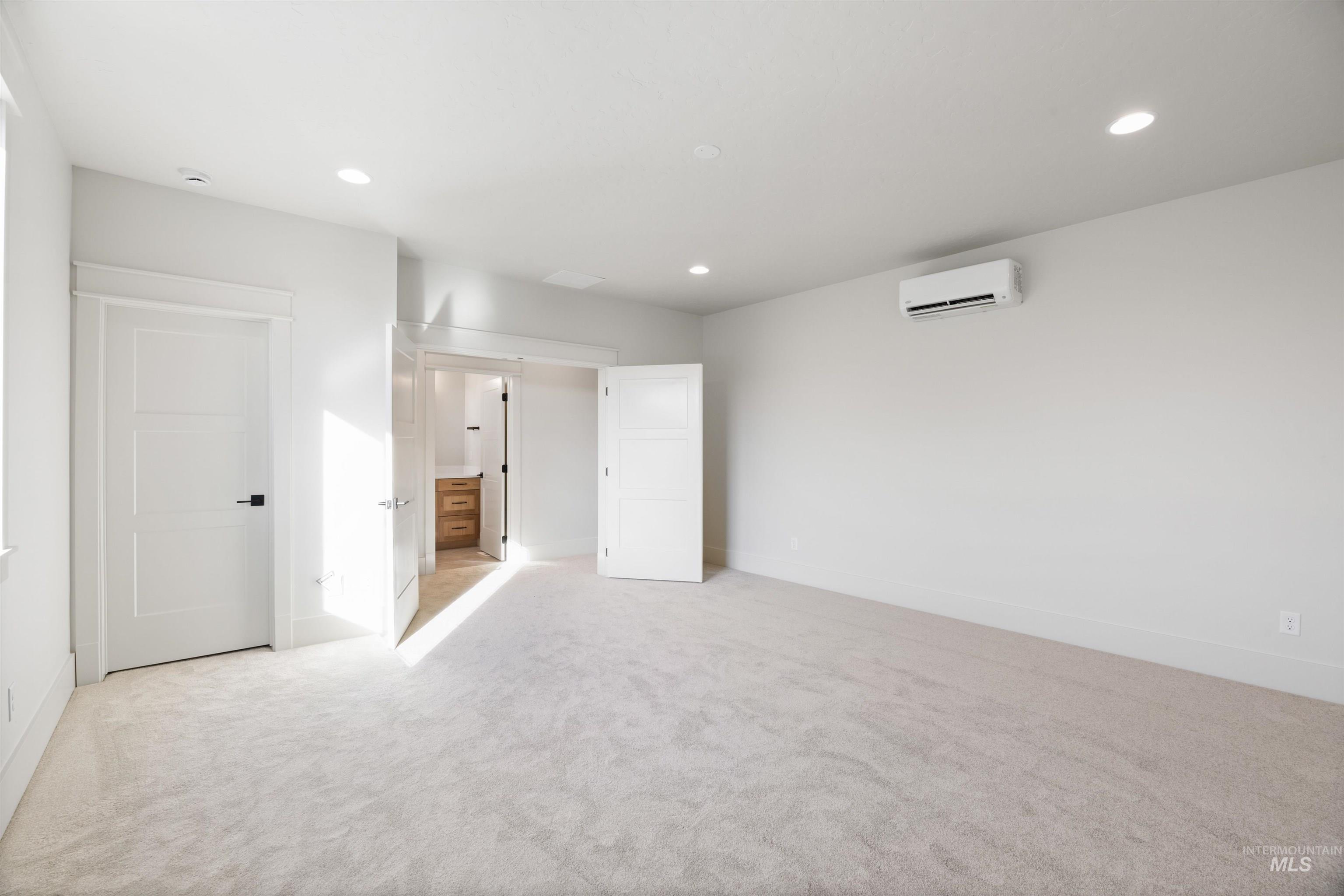 1090 East Crescendo Street Meridian, ID 83642 - Photo 39 of 50 Unfurnished bedroom with light colored carpet, a wall mounted mini split, and recessed lighting