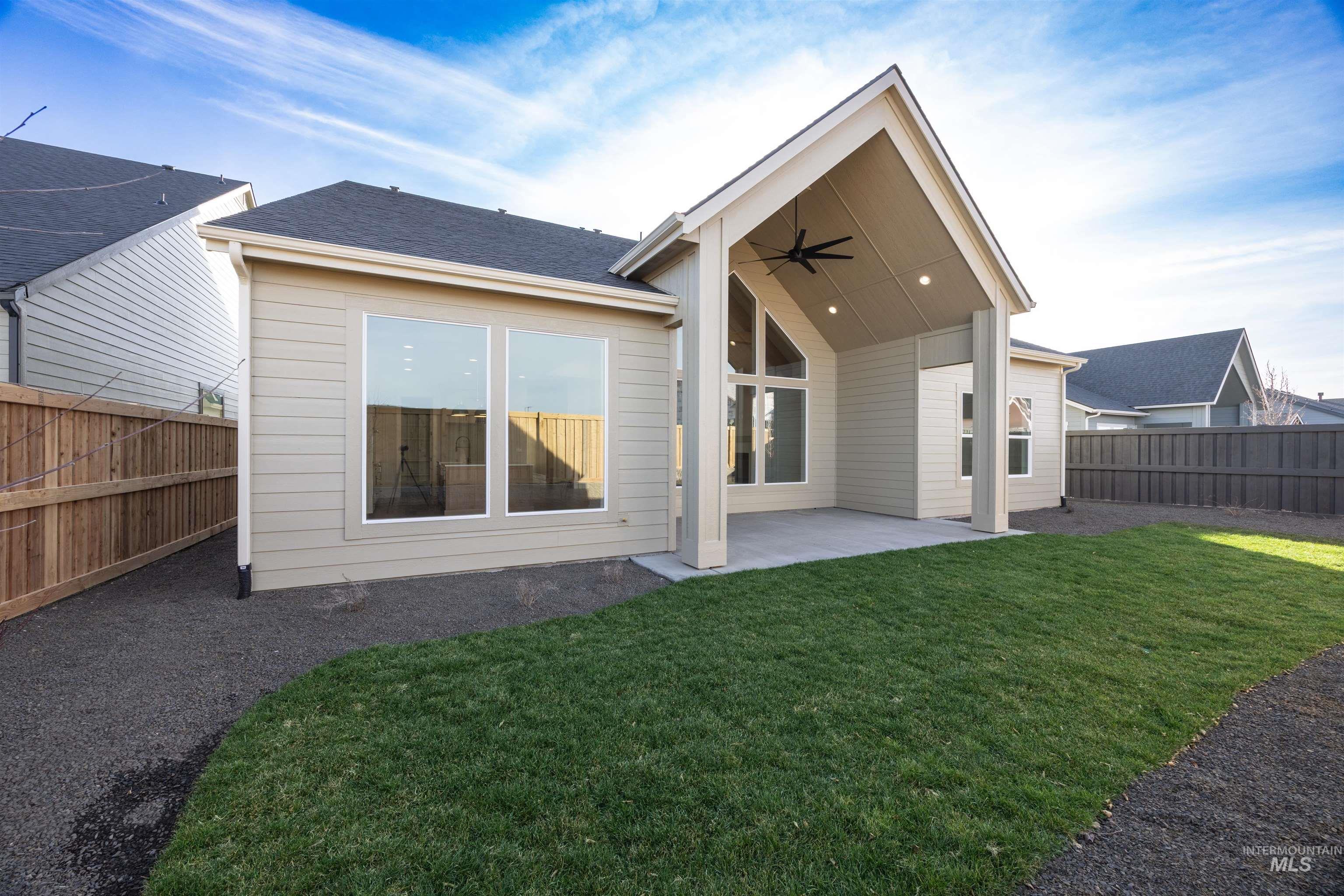 1090 East Crescendo Street Meridian, ID 83642 - Photo 42 of 50 Rear view of house with a fenced backyard, a ceiling fan, a patio area, and a shingled roof