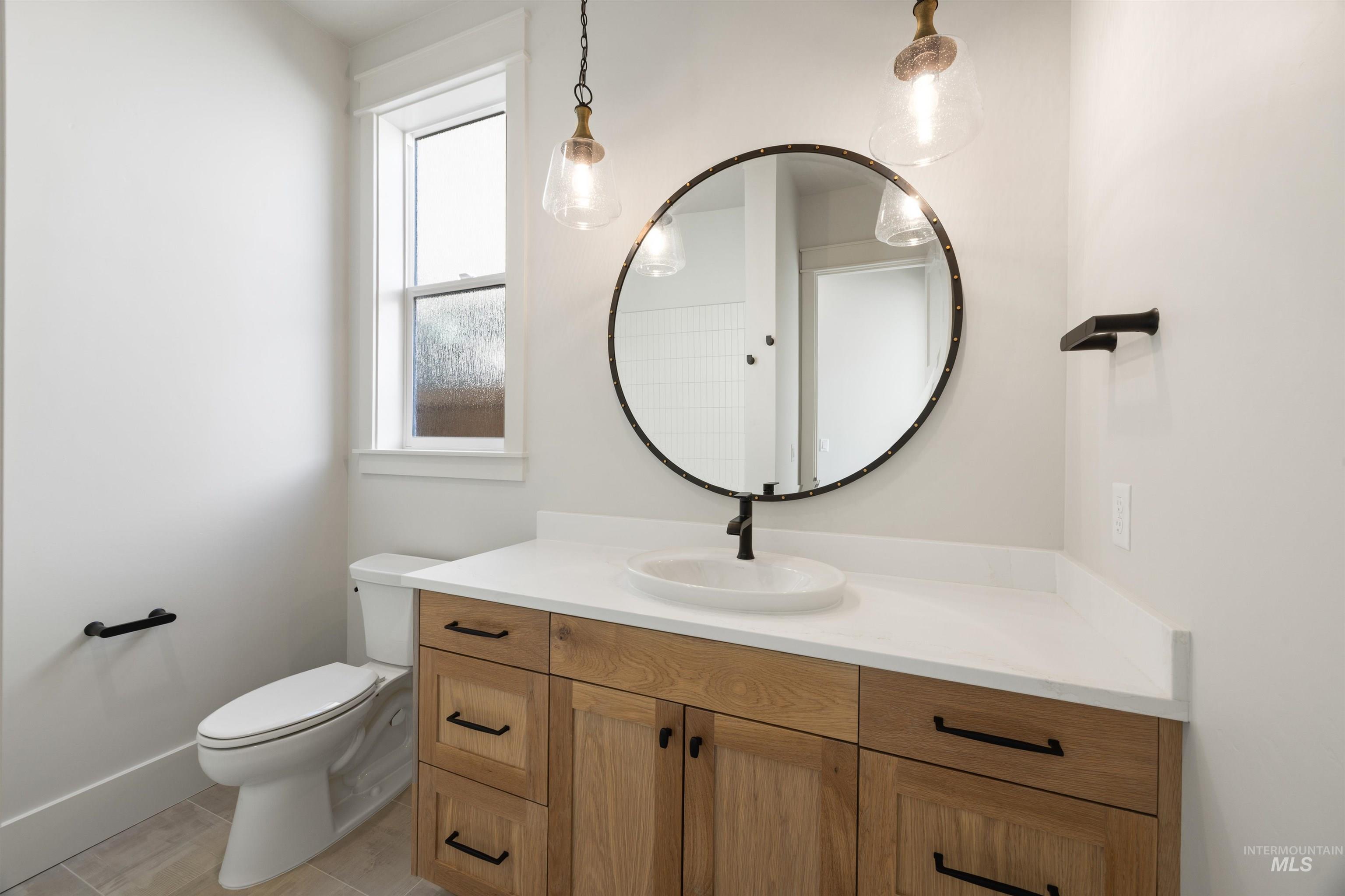 1090 East Crescendo Street Meridian, ID 83642 - Photo 6 of 50 Bathroom featuring toilet and vanity