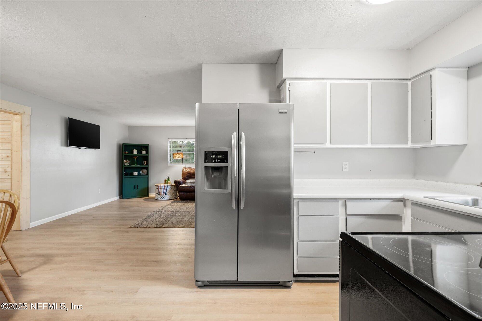 2025 Kate Street Palatka, FL 32177 - Photo 11 of 36 a kitchen with stainless steel appliances a refrigerator and a sink