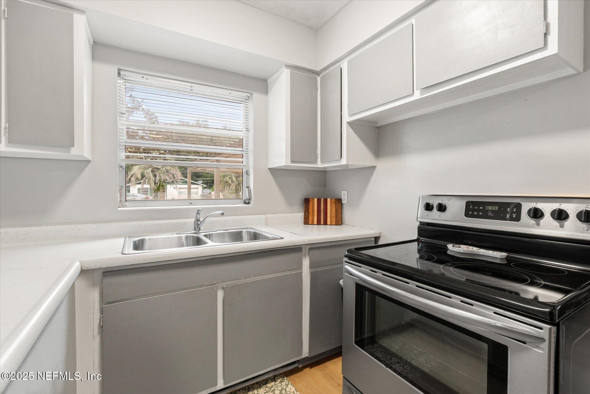 2025 Kate Street Palatka, FL 32177 - Photo 12 of 36 a kitchen with a stove and a sink